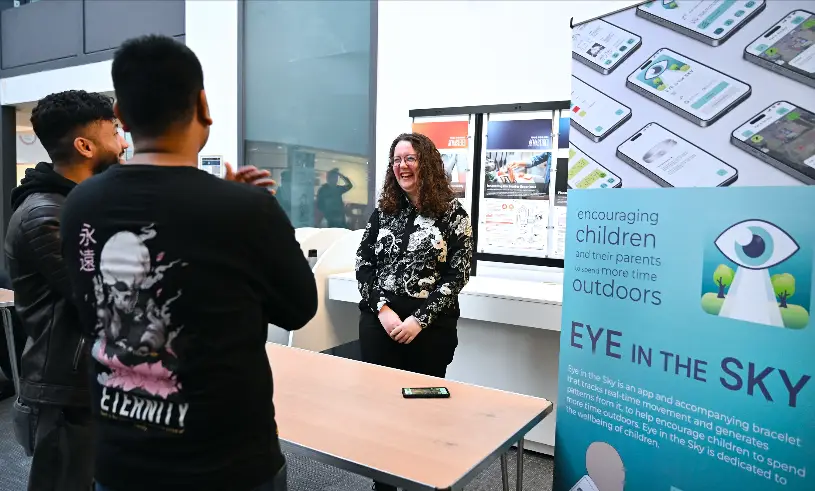 Brunel graduate Tia Phillips, founder of Eye in the Sky speaking with attendees 
